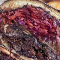 The Spicy Slaw Sandwich Steak · Brioche bun, mayonnaise, steak, sautéed onion and mushroom, pepper jack cheese, and slaw.  S...