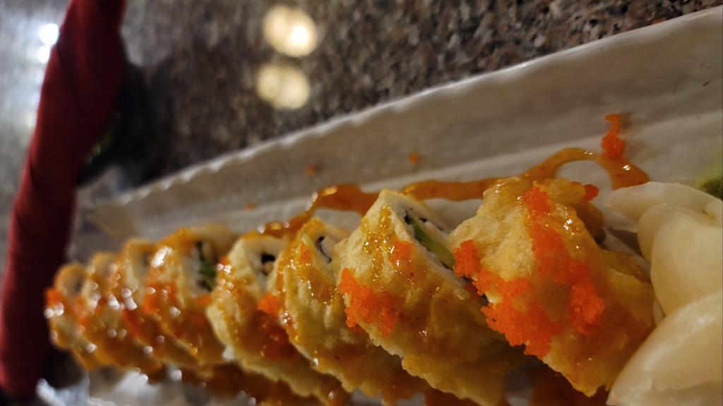 Godzilla Roll · (Avocado, cream cheese, ebi) tempura fried roll, sweet chili sauce, masago.