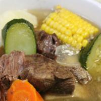 Caldo De Res · Mexican beef soup: chunks of tender beef and fresh vegetables: chayote, corn, potato, and ca...