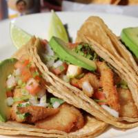 Tacos De Pescado · Three tacos filled with simmered tilapia fillets, topped with our delicious chipotle-ranch s...