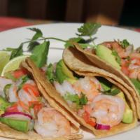 Tacos De Camaron (Shrimp) · Three grilled shrimp tacos topped with lettuce tomato and cheese. Choice of flour or corn to...