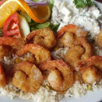 Camarones Empanizados · Butterflied shrimp breaded with our own spices and served white rice, avocado, and potato sa...