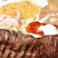 Carne Asada A La Tamiquena · Tender skirt steak prepared to your taste. Served with a cheese enchilada, refried beans, an...