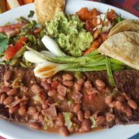 Carne Asada Zamora · Skirt steak cooked to your taste and topped with our original frijoles charros. Served with ...