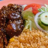 Pollo Con Mole Poblano · Tender pieces of chicken simmered in our delicious and unique mole sauce. Served with refrie...