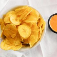 Chifles / Plantain Chips · Ecuadorian fried plantain chips served with a mild tomato herb spice sauce.