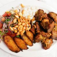 Fritada · Roasted pork chunks, served with fried sweet plantain, white hominy, dry corn, salad and mil...