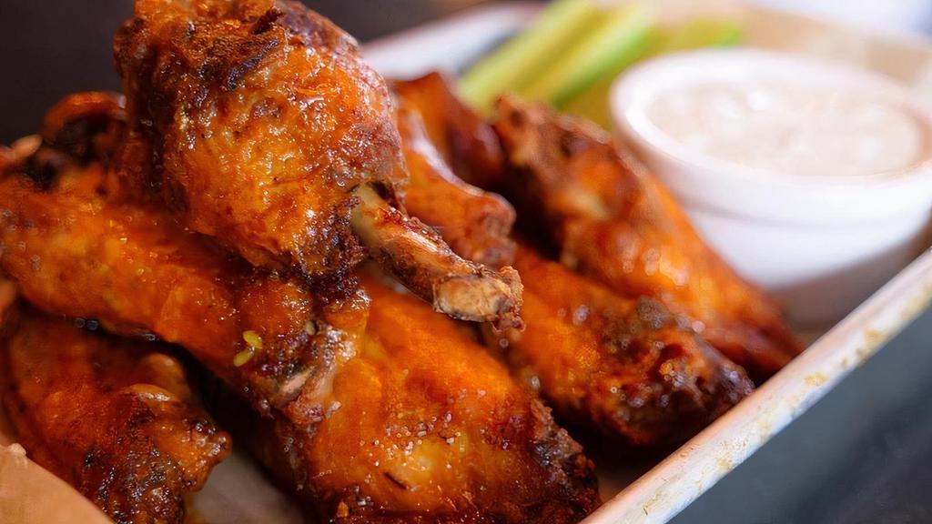 Wings · 1 pound of fresh wings, par baked with a cajun house rub, deep fried and tossed with your choice of sauce.
