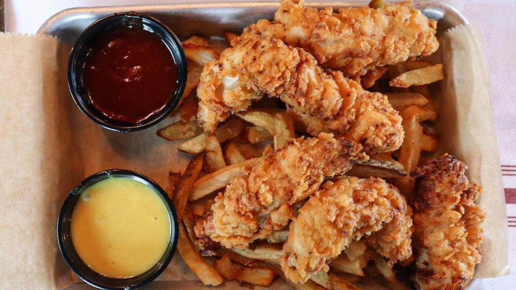 Chicken Tender Basket · 5 hand breaded chicken tenders, fried golden brown.  Served on a bed of hand-cut fries.