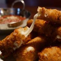 Mozzarella Sticks · Hand cut mozzarella battered and coated in herb breadcrumbs and fried golden brown served wi...