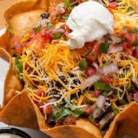 Taco Salad · Deep fried tortilla stuffed with spring mix, seasoned ground beef, monterey jack and cheddar...