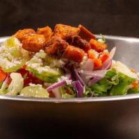 Moran'S Signature Salad · Spring mix topped with carrots, cucumber, celery, tomatoes, onion and gralic croutons; garni...