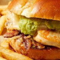 Lynne'S Chicken Sandwich · Blackened grilled chicken, caramelized onions, avocado mousse, Monterey jack cheese and smok...