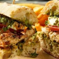Chicken Caprese Sandwich · Fresh grilled chicken served on a ciabatta roll with spinach and basil pesto, fresh buffalo ...