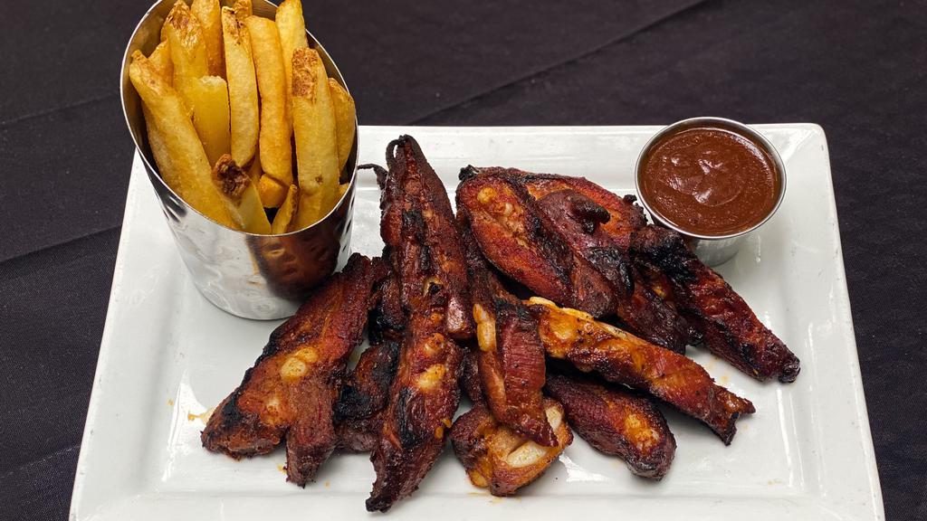 Rib Tips Plate · 1 pound of slow smoked rib tips, served with a side of our texas mop bbq sauce, and french fries.