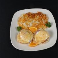 Eggs Benedict · Two Traditional poached eggs, served on English muffin with Canadian bacon and hollandaise s...