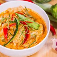 Panang Curry · Red panang curry paste with coconut milk, bell pepper, and green bean. Spicy.