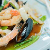 Combination Seafood · Shrimp, scallops, squid, mussels, crab meat, peapods, baby corn, carrots, onions & basil lea...