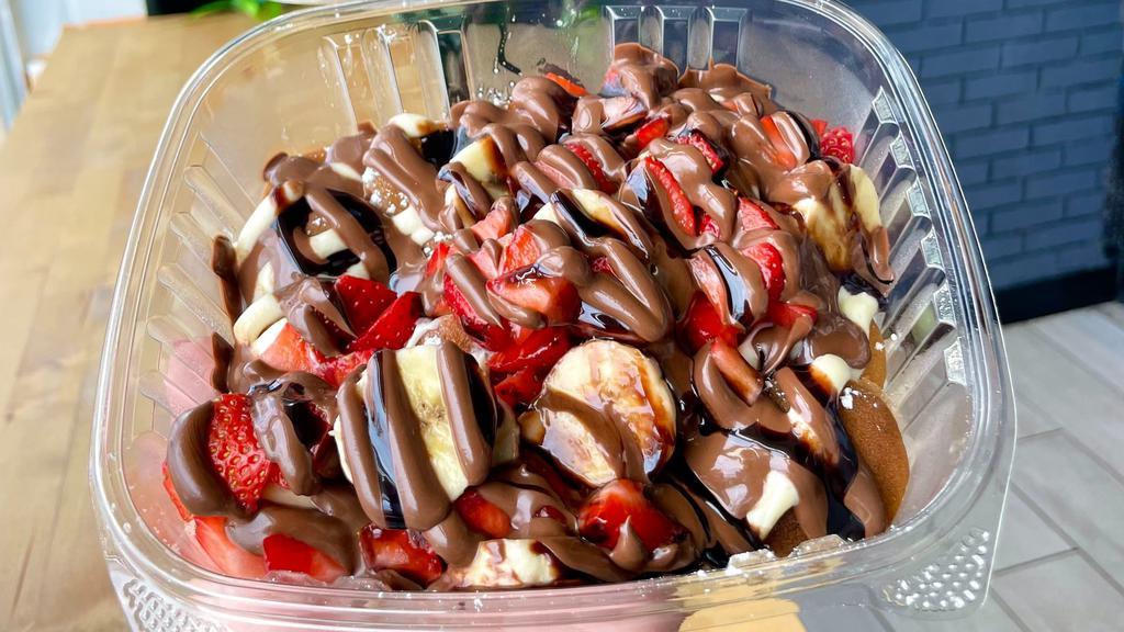 Classic Nutella Mini Pancakes · Classic batter, strawberries, banana, Nutella, chocolate syrup, and S.S.S.