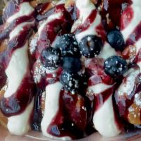 Berrylicious Mini Pancakes · Classic batter, cheese filling, choice of blueberry, raspberry, or strawberry sauce, and S.S...