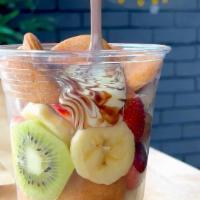 Classic Fruit Cup · Mini pancakes, strawberries, bananas, and kiwis with a side of Nutella, white chocolate and ...
