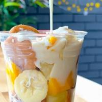 Piña Colada Fruit Cup · Mini pancakes, mangos, pineapples, bananas, and coconut flakes with a side of piña colada sa...