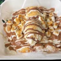 S'Mores Bubble Waffle · Vanilla ice cream, graham crackers, toasted marshmallow sauce and milk chocolate topped with...