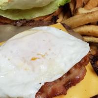 Breakfast Burger · Charbroiled burger topped with cheddar cheese, bacon, fried egg, lettuce tomato and onion. S...