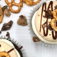 Peanut Butter Crunch Cupcake · Rich chocolate cake filled with a sweet caramel filling, topped with peanut butter buttercre...