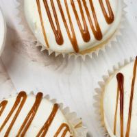 Salted Caramel · Classic vanilla cake filled with a delicious caramel filling, topped with vanilla buttercrea...