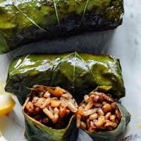 Dolmadaka (Stuffed Grape Leaves) · Grape leaves stuffed with lean ground beef, lamb, rice and Greek Herbs then topped with avgo...