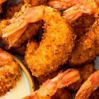 Coconut Shrimp · Lightly breaded and fried, topped with a coconut sauce.
