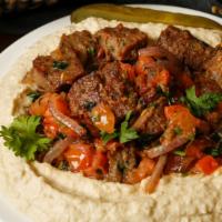 Hummus Shawarma · Your choice of chicken, beef, gyro or mixed vegetables sautéed with onions and tomatoes.