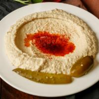 Hummus · Creamy puree of chickpeas blended with tahini, garlic and lemon juice.