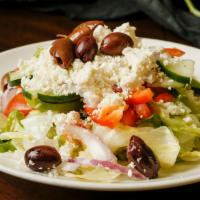 Large Greek · Iceberg and romaine lettuce topped with cucumbers, tomatoes, onions, bell peppers, feta, oli...
