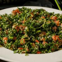 Large Tabouli · Chopped parsley, tomatoes, onions, and bulgur wheat mixed with an olive oil and lemon juice ...