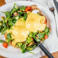 Veggie Benny · Homemade toast, broccoli, spinach, onion, tomato, mushrooms, poached eggs, and hollandaise s...