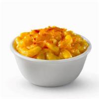 Baked Mac & Cheese · We take mac & cheese, sprinkle shredded cheddar cheese on top, then bake it to golden perfec...