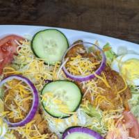 Chicken Strip Salad · Garden Salad topped with two chicken strips, cheese, bacon bits, tomato, onion and cucumbers...