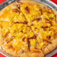 10 Inch Breakfast · Biscuit dough crust, bacon, sausage gravy, scrambled eggs, cheddar cheese