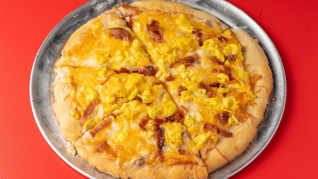 10 Inch Breakfast · Biscuit dough crust, bacon, sausage gravy, scrambled eggs, cheddar cheese
