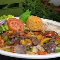 Bistec A La Mexicana · Succulent pieces of steak sauteed with bell peppers, Spanish onions, and tomatoes. Served wi...