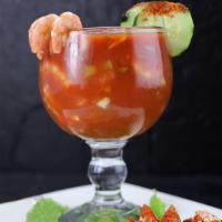 Coctel De Camaron  · Shrimp with chopped cilantro, onions, tomatoes, and avocado. Served on a goblet in its own j...