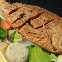 Huachinango · Crispy deep-fried red snapper. Served with steamed vegetables,  rice, slices of avocado, let...