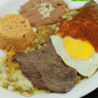 Chilaquiles · Traditional chilaquiles sauteed in green or red salsa accompanied with steak and one sunny s...