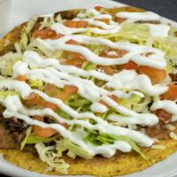 Tostadas Mexican Style · Served Mexican style (cilantro, onions, and beans) with your choice of meat.