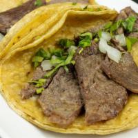 Cecina Tacos · Served Mexican style with onions, and cilantro.