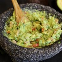 Guacamole · Fresh hass avocado with onion, tomato, cilantro, and fresh lime juice.