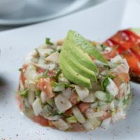 Ceviche De Pescado · Fresh fish cooked in a lime marinade, mixed with pico de gallo and slices of avocado.