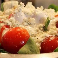Spinach Blue Salad · Spinach topped with fresh tomato and blue cheese crumbles. Buttermilk dressing served on the...